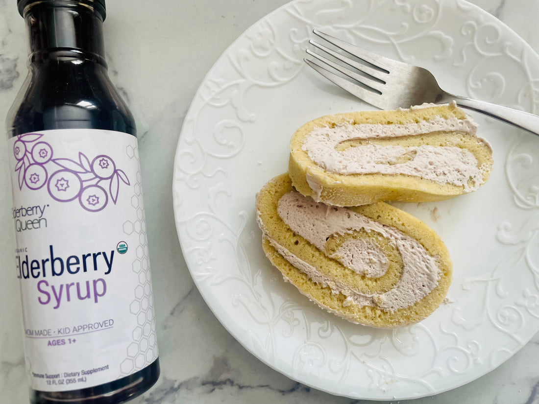 elderberry cake roll with a bottle of elderberry syrup